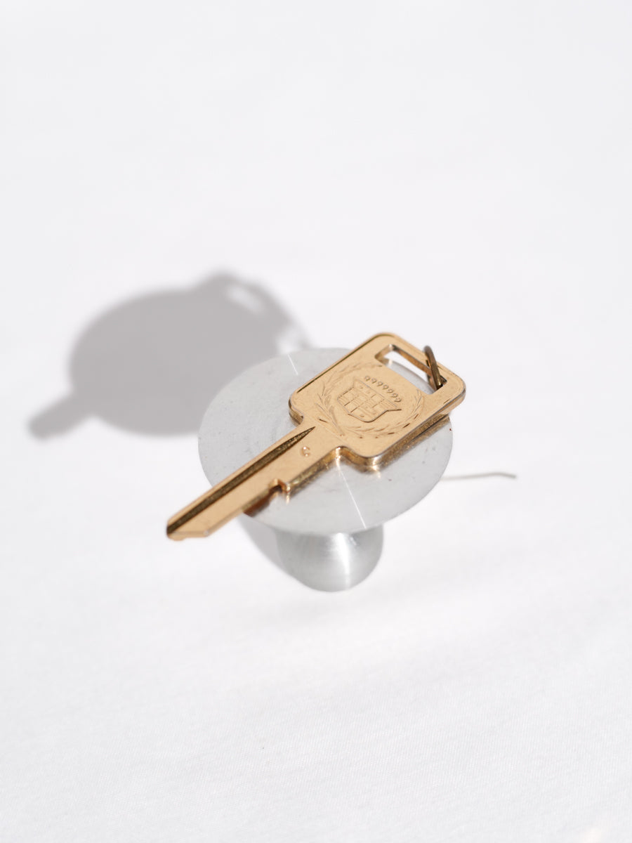 Cadilac gold single earring